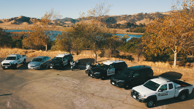 Police Vehicles Aerial Photo includes: 2 Motorcycles, 2 Interceptors, 2 Pickups, 1 Sedan and 1 SUV