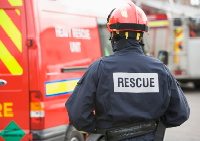 Firefighter with"rescue" on his back