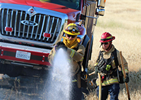 fire fighter with hose