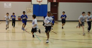 A group of students playing basketball.