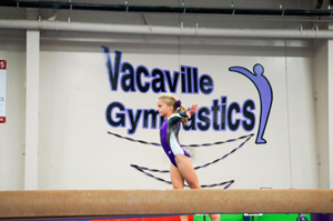 A student performing gymnastics.