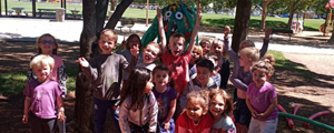 A group of preschool students in a park.