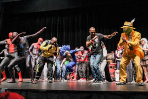 A group of people dancing on a stage.